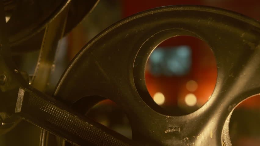 detail vintage movie projector. cinematic  atmosphere evokes classic film screenings. 