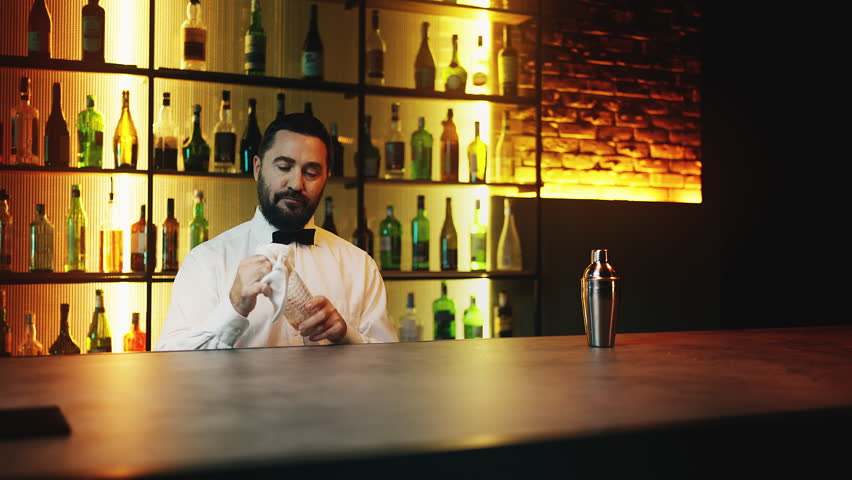 Red-haired female customer sitting at bar counter, ordering cocktail, night out