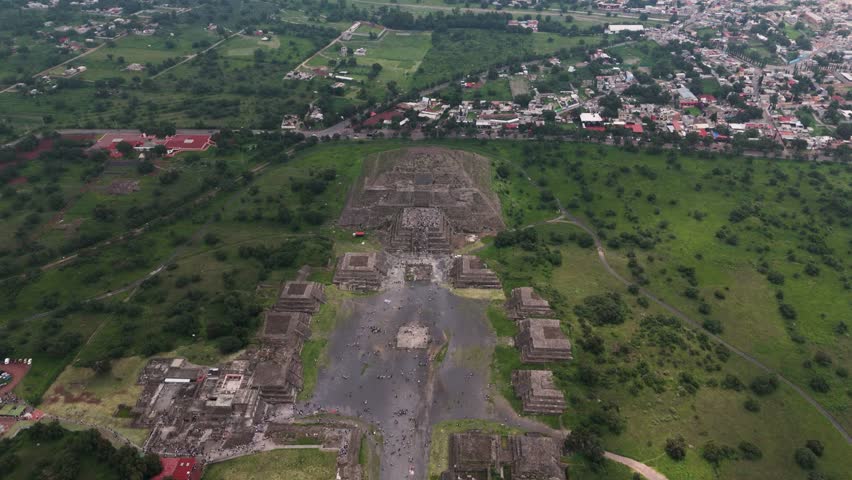 Aerial footage showing visitors on Pyramid of the Moon in Teotihuacan, Mexico.