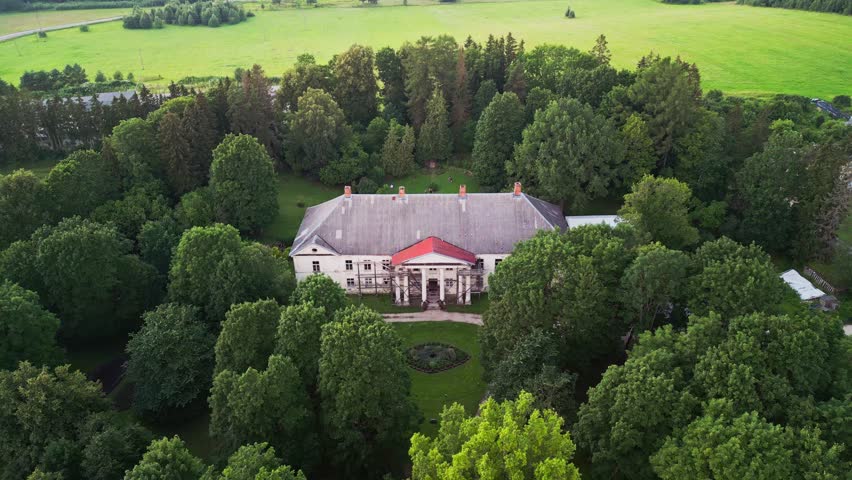 Scenic drone footage of Kirna Manor highlights the historic estate in Järva County Estonia blending classical architecture with calm green landscapes often visited for cultural and wellness tourism.