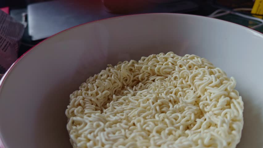 freshly prepared instant ramen noodles in disposable cup. Asian noodle cuisine. fast meal solutions and traditional food. instant ramen. Noodle soup with dry seasoning. Asian quick meal instant noodle