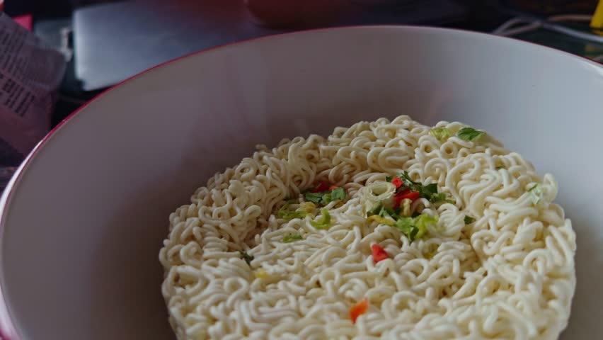 freshly prepared instant ramen noodles in disposable cup. Asian noodle cuisine. fast meal solutions and traditional food. instant ramen. Noodle soup with dry seasoning. Asian quick meal instant noodle