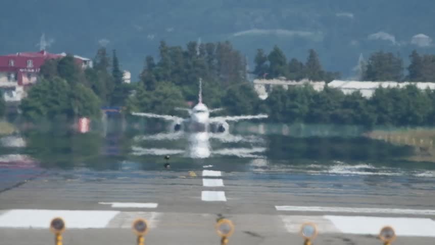 An airplane taking off at the airport. The takeoff of an airplane at Batumi Airport. Slow-motion video
