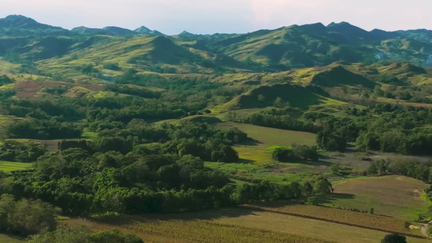 4K Aerial Of Caraballo Mountain, Lush Rice Fields in Quezon, Isabela, Philippines
he serene beauty and immense scale of the agricultural landscape, with the majestic mountains as a dramatic backdrop