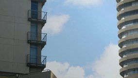 On load, American flag overlay rippling across towers while moon drifting for patriotic view. Skyscrapers, urban landscape, flag, celestial, architecture, modern, patriotic - Powered by Shutterstock - Get 15% off with code: PIKWIZARD15