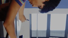 Animation of data processing over diverse students writing. Global education and digital interface concept digitally generated video. - Powered by Shutterstock - Get 15% off with code: PIKWIZARD15