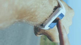 Animation of data processing on digital screen over hands of caucasian man using smartwatch. Active lifestyle, communication and technology concept digitally generated video. - Powered by Shutterstock - Get 15% off with code: PIKWIZARD15