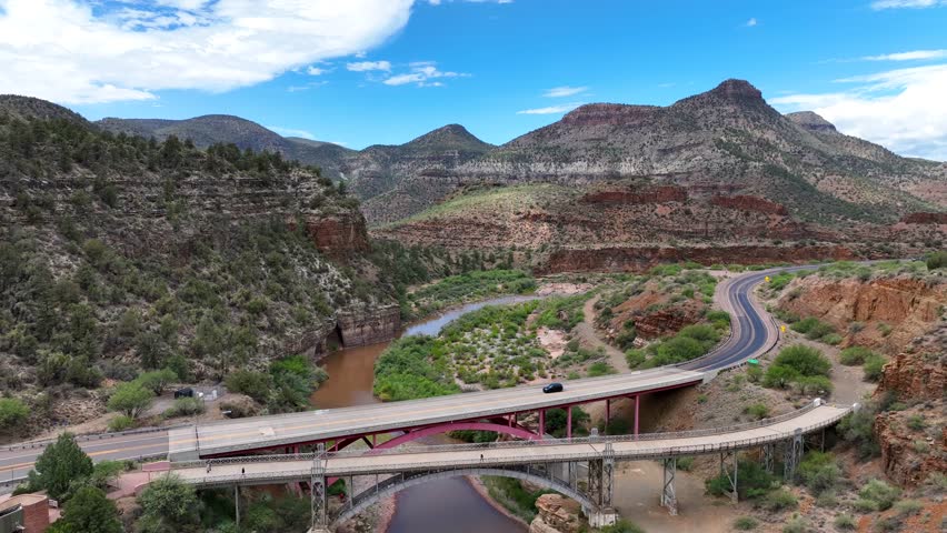 Aerial view of the Salt River Canyon bridge over the river, a picturesque scene of nature meeting infrastructure under a bright sky, Salt River Canyon, az, United States.