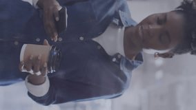 Animation of statistical data processing over african american woman talking on smartphone at office. Computer interface and business data technology concept - Powered by Shutterstock - Get 15% off with code: PIKWIZARD15