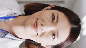 Animation of science data over asian female doctor smiling. Medicine, technology and digital interface concept digitally generated video. - Powered by Shutterstock - Get 15% off with code: PIKWIZARD15