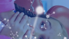 Animation of molecules over caucasian male dentist and girl patient. Global medicine, healthcare and digital interface concept digitally generated video. - Powered by Shutterstock - Get 15% off with code: PIKWIZARD15