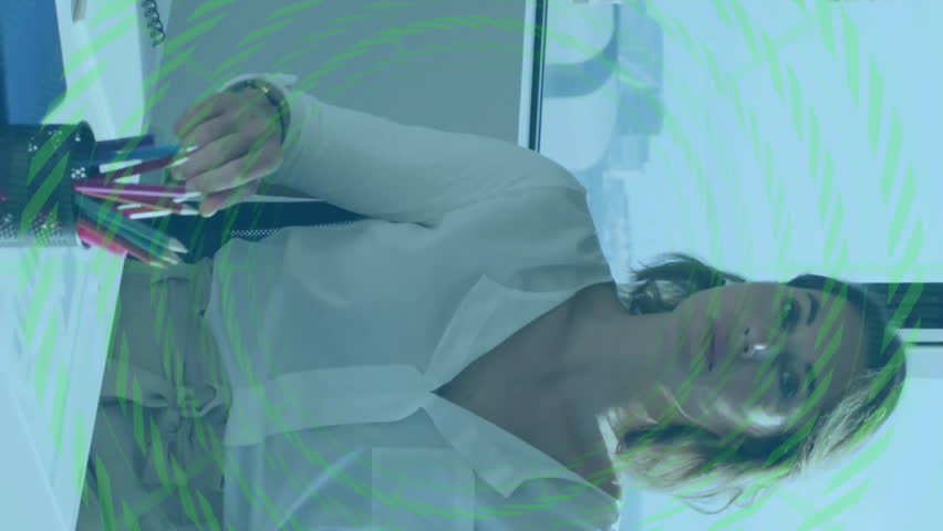 Financial data processing animation over businesswoman sitting at office desk. Finance, corporate, technology, analysis, computer, professional - Powered by Shutterstock - Get 15% off with code: PIKWIZARD15