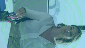 Financial data processing animation over businesswoman sitting at office desk. Finance, corporate, technology, analysis, computer, professional - Powered by Shutterstock - Get 15% off with code: PIKWIZARD15