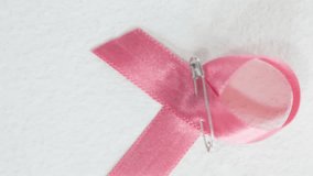 Animation of get involved and globe over pink and yellow ribbons. breast cancer positive awareness campaign concept digitally generated video. - Powered by Shutterstock - Get 15% off with code: PIKWIZARD15