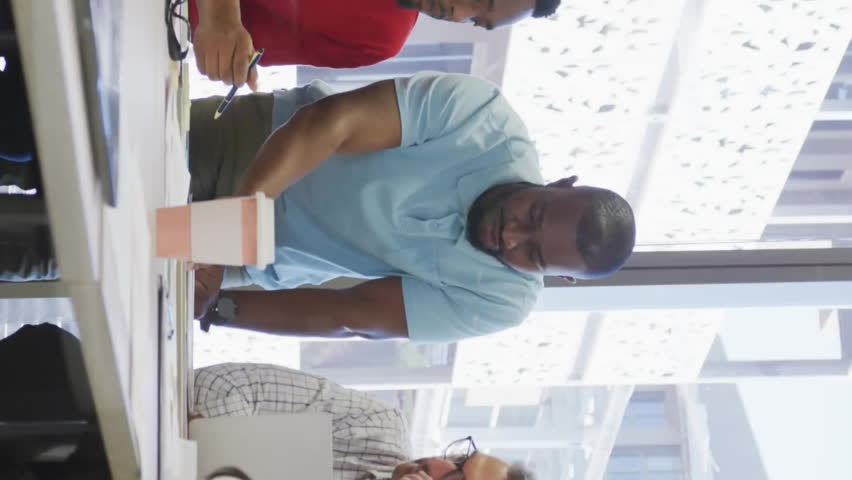 Business team collaborating at office with data processing animation overlay. Teamwork, collaboration, data analysis, innovation, brainstorming, corporate - Powered by Shutterstock - Get 15% off with code: PIKWIZARD15