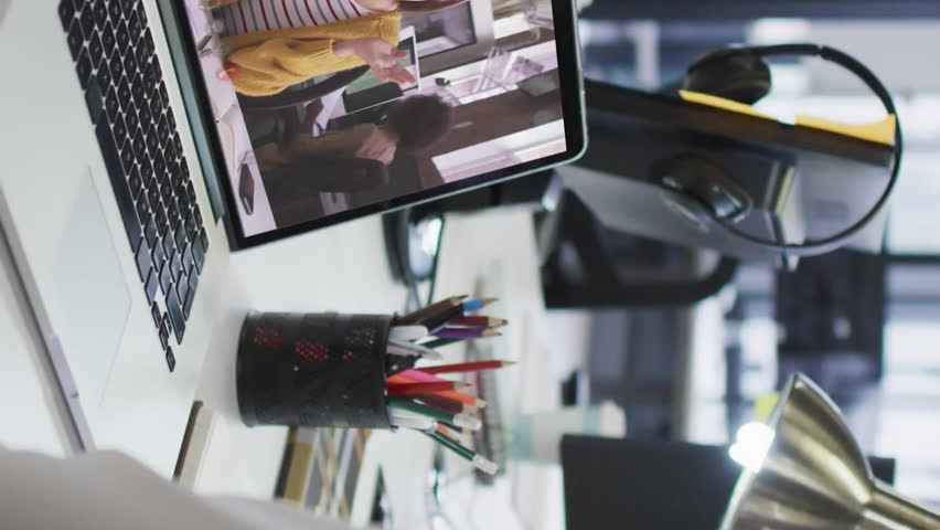 Person working at desk with video call and data processing animation overlaid. Technology, virtual meeting, communication, remote work, digital, multitasking - Powered by Shutterstock - Get 15% off with code: PIKWIZARD15