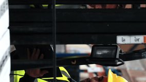 Operating forklift with digital interface, workers in safety gear in warehouse. Logistics, supply chain, industrial, technology, transportation, machinery - Powered by Shutterstock - Get 15% off with code: PIKWIZARD15