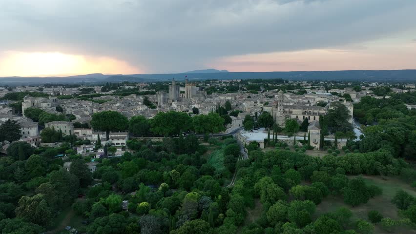 Historic Town Of Uzes At Sunset In Gard, Occitanie Region Of Southern France. Aerial Drone Shot