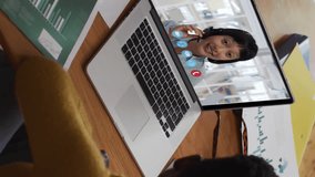 Animation of setting over a cloud icon over african american woman having a video call on laptop. Global networking and business technology concept - Powered by Shutterstock - Get 15% off with code: PIKWIZARD15