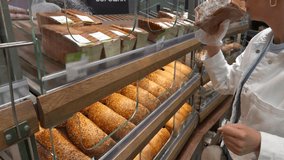 Freshly baked bread at bakery counter. Healthy multigrain bread and whole wheat loaves. Select artisan baked goods. Traditional baking culinary craftsmanship fresh food bread. Baked bread assortment - Powered by Shutterstock - Get 15% off with code: PIKWIZARD15