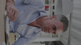 Animation of infographic interface over caucasian businessman working over computer on desk. Digital composite, multiple exposure, finance, business, report, technology, data processing, office. - Powered by Shutterstock - Get 15% off with code: PIKWIZARD15