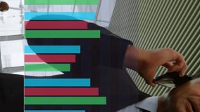 Animation of multicolored bar graphs over caucasian man talking on smartphone in office. Digital composite, multiple exposure, report, business, communication and technology concept. - Powered by Shutterstock - Get 15% off with code: PIKWIZARD15