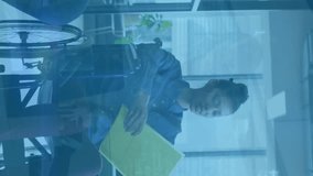 Animation of financial data processing over diverse business people in office. Global finance, business, connections, computing and data processing concept digitally generated video. - Powered by Shutterstock - Get 15% off with code: PIKWIZARD15