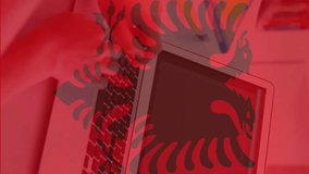 Animation of flag of albania over caucasian businesswoman using laptop. Patriotism, business and digital interface concept digitally generated video. - Powered by Shutterstock - Get 15% off with code: PIKWIZARD15