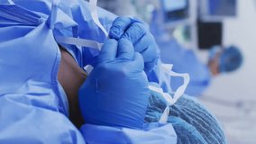 Animation of data processing over diverse surgeons during operation. Global medicine and digital interface concept digitally generated video. - Powered by Shutterstock - Get 15% off with code: PIKWIZARD15