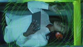 Using tablet with green digital data animation overlay in school setting. Technology, innovation, education, touchscreen, interactive, classroom - Powered by Shutterstock - Get 15% off with code: PIKWIZARD15