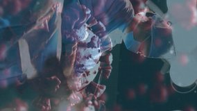 Animation of covid 19 cell over surgeons in face masks. global covid 19 pandemic, medicine and healthcare services concept digitally generated video. - Powered by Shutterstock - Get 15% off with code: PIKWIZARD15