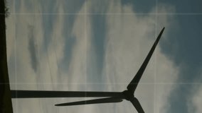 Animation of financial graphs over wind turbine. green energy, eco power, finance and technology concept digitally generated video. - Powered by Shutterstock - Get 15% off with code: PIKWIZARD15