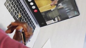 Animation of financial data processing over african american man on laptop video call. Global finance, business, connections, computing and data processing concept digitally generated video. - Powered by Shutterstock - Get 15% off with code: PIKWIZARD15