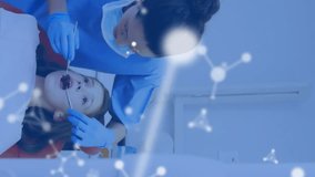 Animation of molecules over caucasian male and female dentists and girl patient. Global medicine, healthcare and digital interface concept digitally generated video. - Powered by Shutterstock - Get 15% off with code: PIKWIZARD15