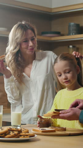 Happy Caucasian family at kitchen parents child kid daughter breakfast together food delivery healthy eating tasty chocolate sandwich mother father little girl insurance loan mortgage credit concept