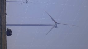 Wind turbines in landscape with financial data processing animation overlay. Renewable, energy, sustainability, environment, clean, technology - Powered by Shutterstock - Get 15% off with code: PIKWIZARD15