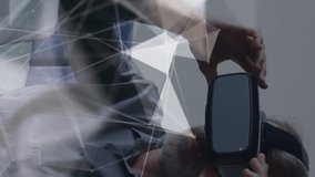 Animation of connections and data processing over caucasian businessman using vr headset in office. Global business, finances, computing and data processing concept digitally generated video. - Powered by Shutterstock - Get 15% off with code: PIKWIZARD15