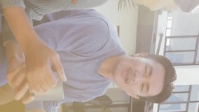 Animation of gold house key and key fob over happy diverse couple in garden at home. House, home, property, ownership and lifestyle concept digitally generated video. - Powered by Shutterstock - Get 15% off with code: PIKWIZARD15