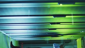 Man talking on phone in server room, data processing animation over servers. Technology, IT, data center, communication, cybersecurity, networking - Powered by Shutterstock - Get 15% off with code: PIKWIZARD15