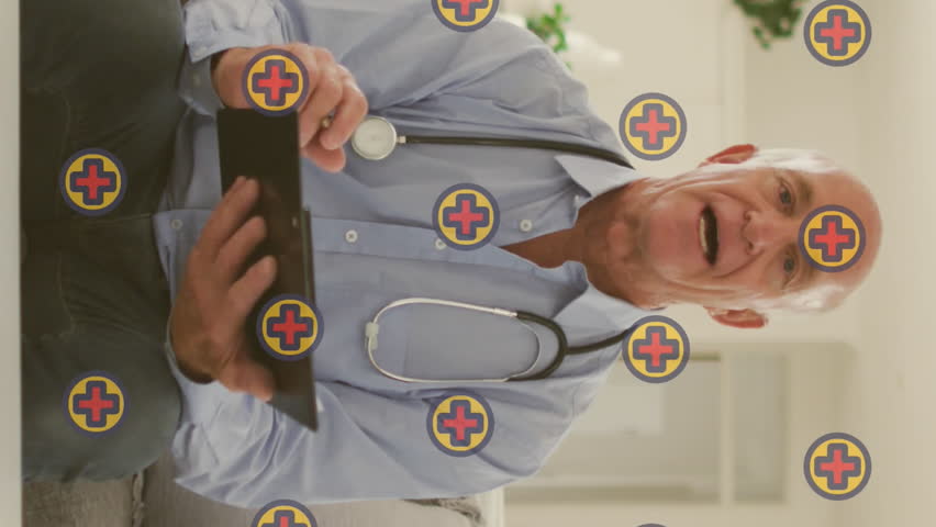 Animation of cross icons over caucasian male doctor having video call. senior home hangout and digital interface concept digitally generated video.