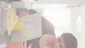 Animation of pride text, rainbow stripes over happy caucasian lesbian couple using tablet at table. Domestic life, communication, lgbtq, gay, lesbian, pride and lifestyle, digitally generated video. - Powered by Shutterstock - Get 15% off with code: PIKWIZARD15