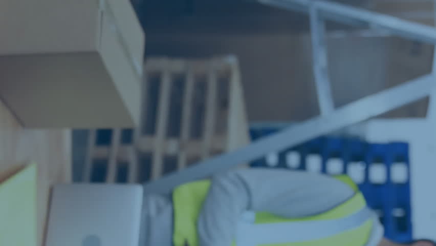 Warehouse workers wearing safety gear with data processing animation overlay. Industry, logistics, technology, teamwork, inventory, machinery - Powered by Shutterstock - Get 15% off with code: PIKWIZARD15