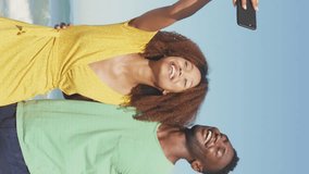 Animation of social media heart icons over smiling couple taking selfie with smartphone on beach. digital interface, social media and global network concept digitally generated video. - Powered by Shutterstock - Get 15% off with code: PIKWIZARD15