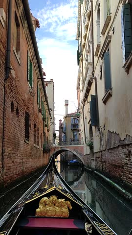 Charming water canal gondola ride in Venice, Italy.