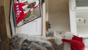 Animation of snow falling over happy caucasian woman in santa hat on laptop video call. christmas, tradition and celebration concept digitally generated video. - Powered by Shutterstock - Get 15% off with code: PIKWIZARD15