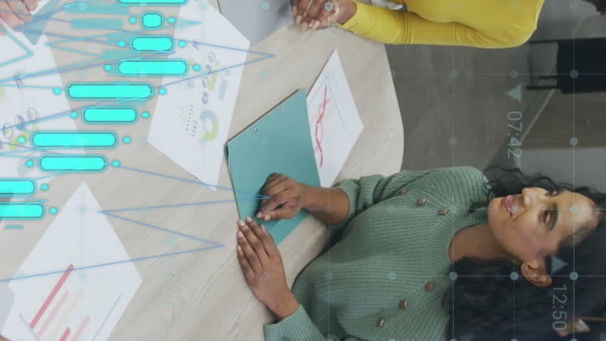 Animation of financial data processing over diverse business people having meeting at office. Global business, finances and digital interface concept digitally generated video. - Powered by Shutterstock - Get 15% off with code: PIKWIZARD15