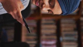 Animation of ai text and data over female student in hijab with smartphone. Global artificial intelligence, connections, computing and data processing concept digitally generated video. - Powered by Shutterstock - Get 15% off with code: PIKWIZARD15