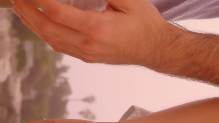 Animation of red heart balloons floating over mid section of couple in love holding hands by seaside. Happy Valentines Day celebration concept digitally generated image.