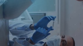 Animation of statistics graph and covid 19 cells with male doctor showing vaccine to man. healthcare and protection during coronavirus covid 19 pandemic, digitally generated video - Powered by Shutterstock - Get 15% off with code: PIKWIZARD15