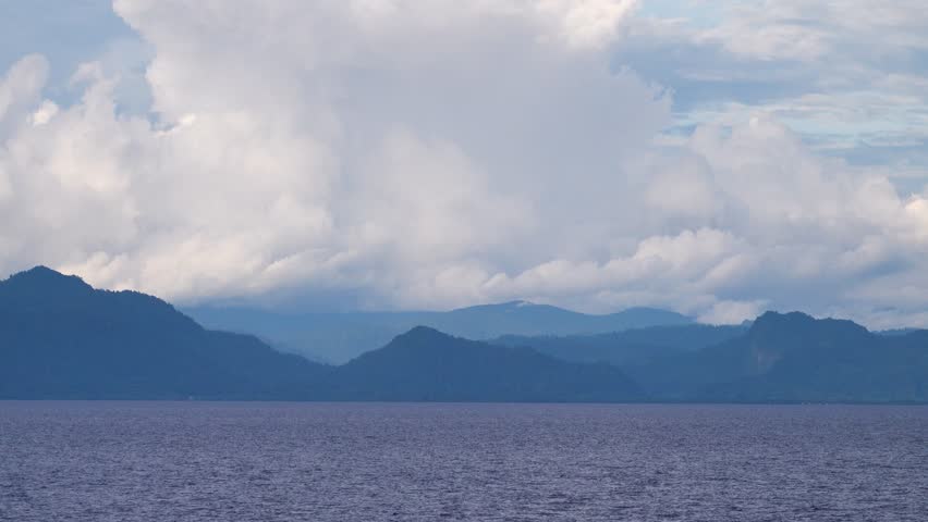 Islands in Flores Sea near Sulawesi, Indian Ocean. Exotic in the tropical Spice Islands (Moluccas). Cruise sea voyage . This picture seen by first Europeans (Dutch) in 16th century.